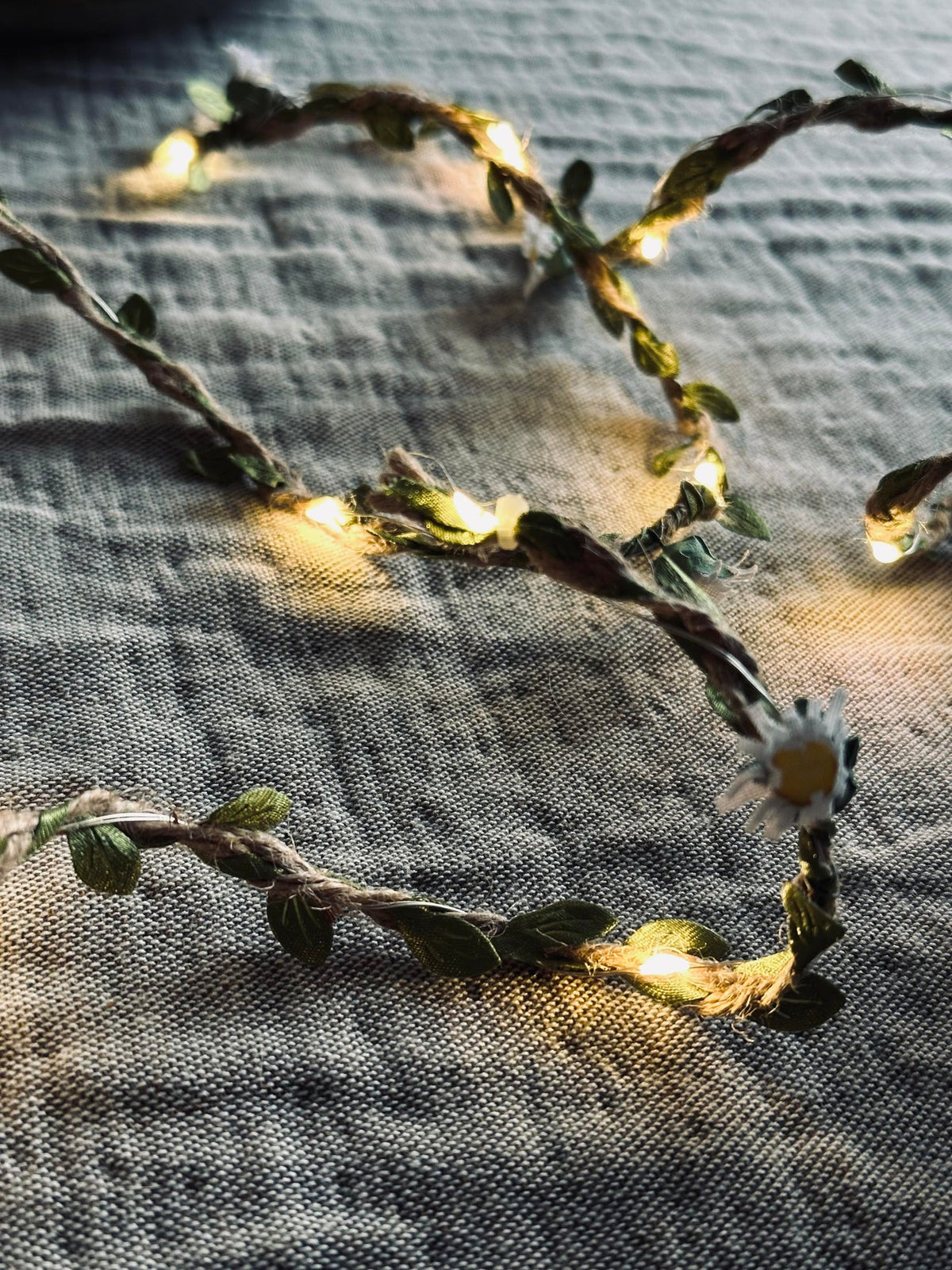 Lichtslinger met bladeren en bloemen