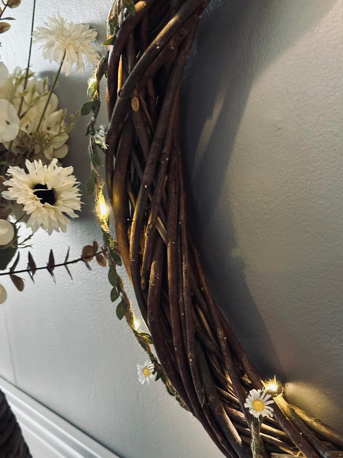 Lichtslinger met bladeren en bloemen