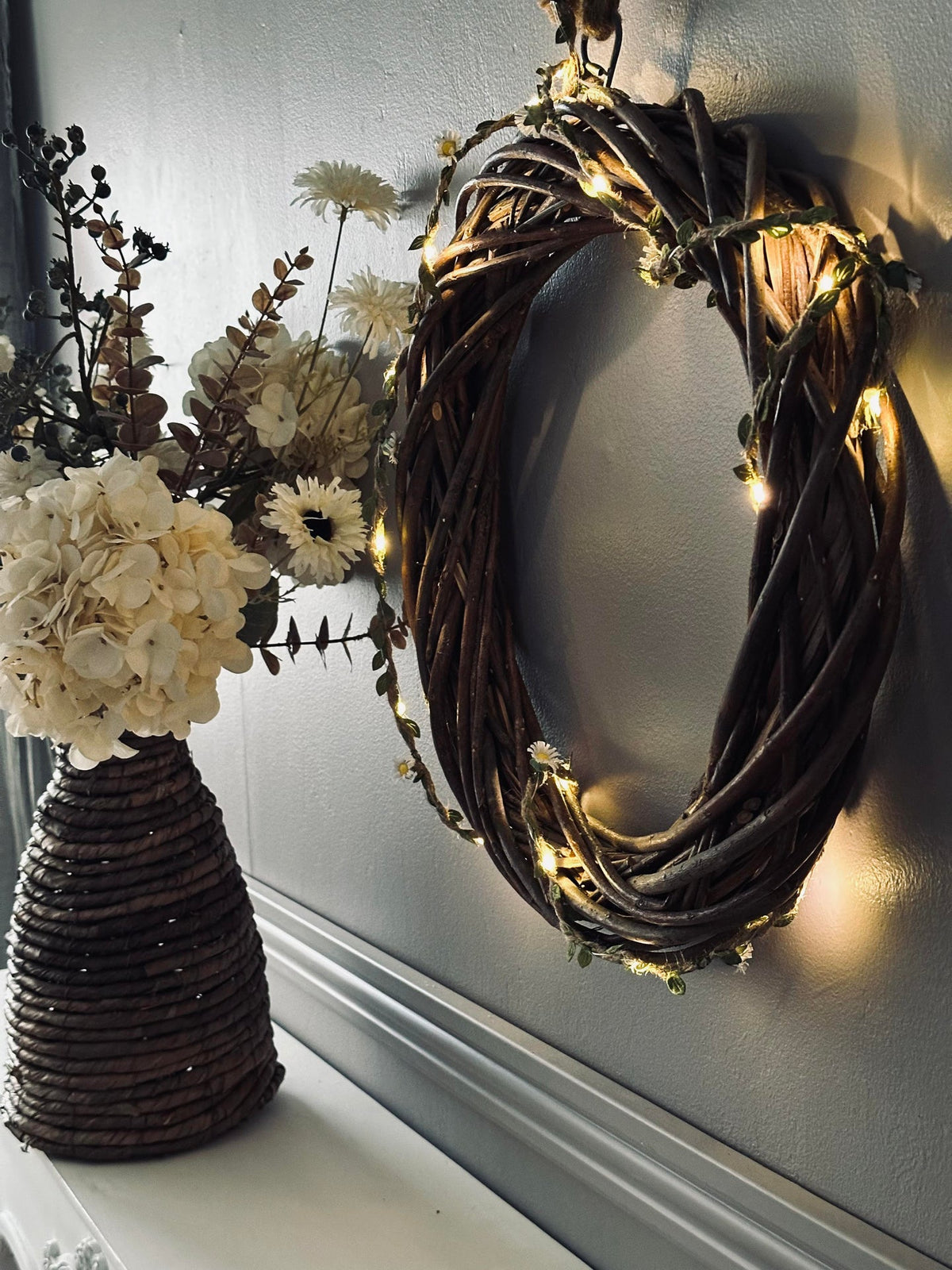 Lichtslinger met bladeren en bloemen