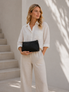 Clutch met geperforeerd patroon - black