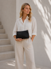 Clutch met geperforeerd patroon - black