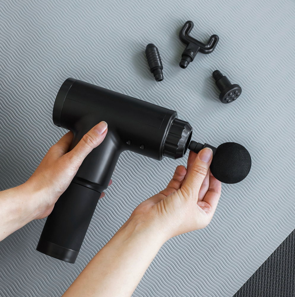 Massagepistool met 4 koppen