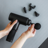 Massagepistool met 4 koppen