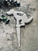 Bord van gietijzer -  pooing "No!"
